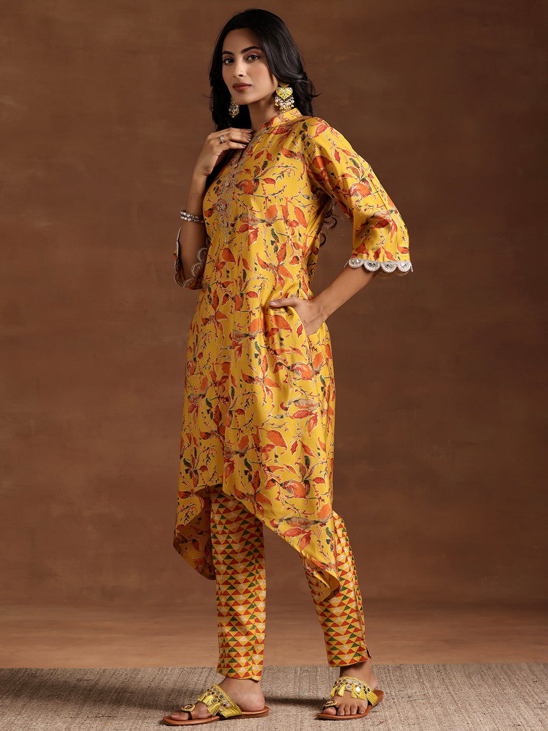 Mustard Printed Silk Blend A-line Kurta With Trousers